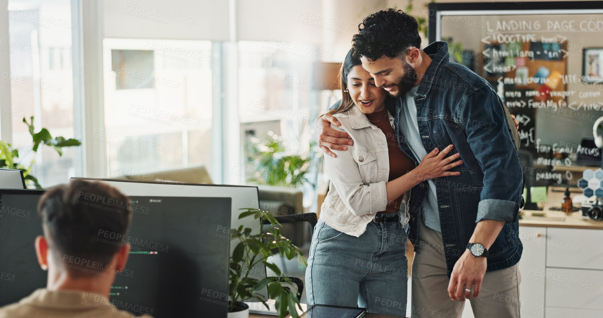 Buy stock photo Woman, man and people hug in startup or office for teamwork, good news and goodbye. Designers, work friends and embrace for support with care, staff announcement or farewell for career opportunity