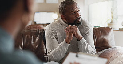 Buy stock photo African man, consultation and psychologist in office with thinking, clipboard and sad memory at clinic. People, therapy and mental health with support for assessment with notes, depression or anxiety