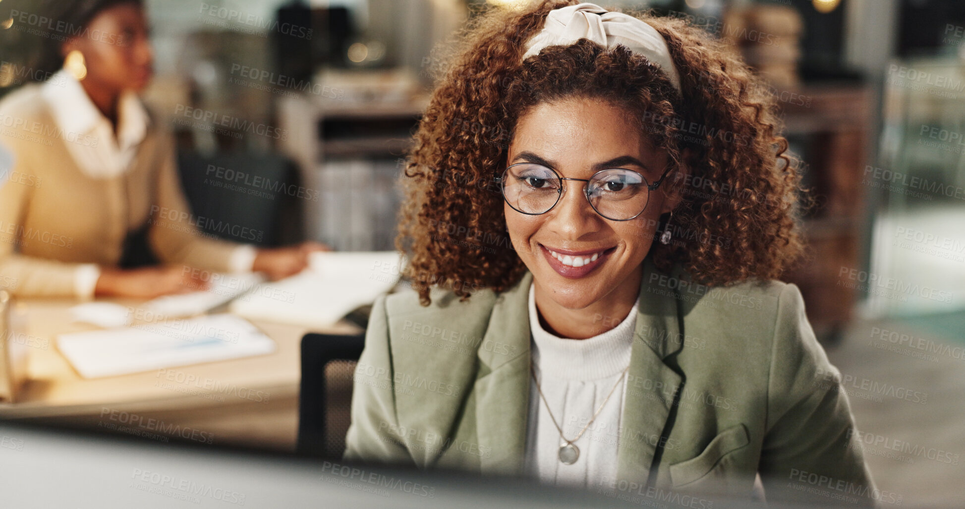 Buy stock photo Woman, computer and smile at night at startup for project, review and deadline at media company. Person, writer and editor by pc for inspiration, overtime and insight in office at creative agency