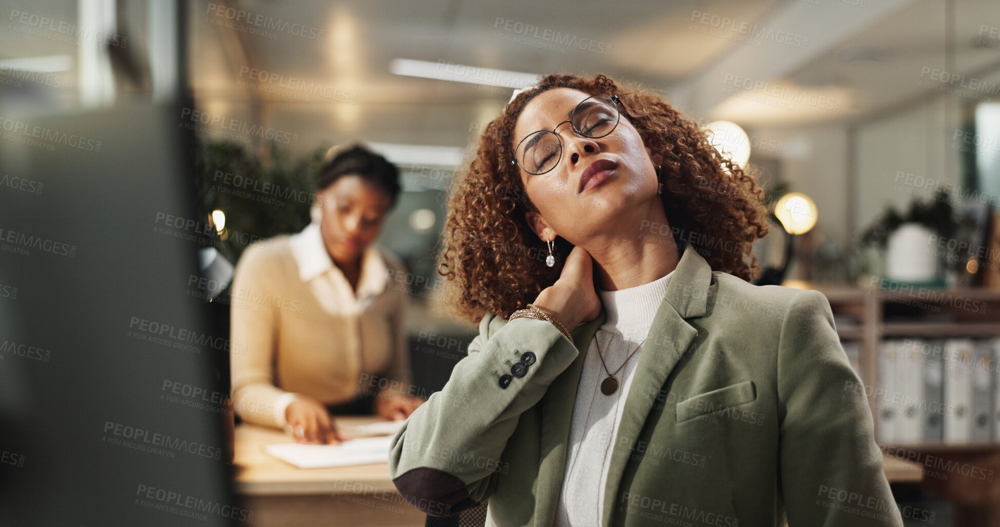 Buy stock photo Woman, neck pain and injury at night in office with stress, frustrated or ache at startup company. Person, strain and laptop with muscle fatigue, burnout or tired with bad posture at creative agency