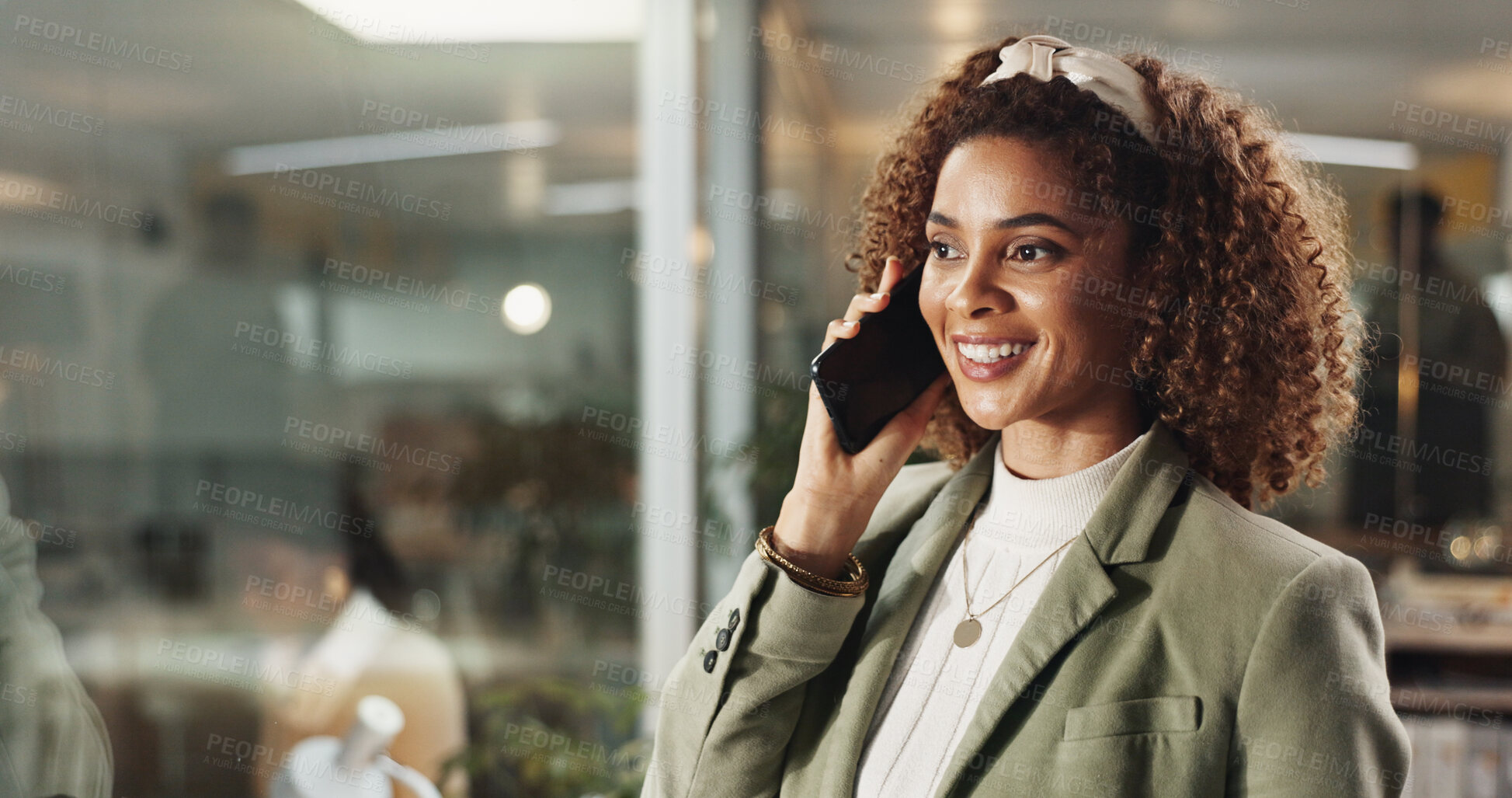 Buy stock photo Woman, phone call and happy at night in office by window with conversation, contact or networking at media company. Person, smile and smartphone with deal, overtime and talking at creative agency