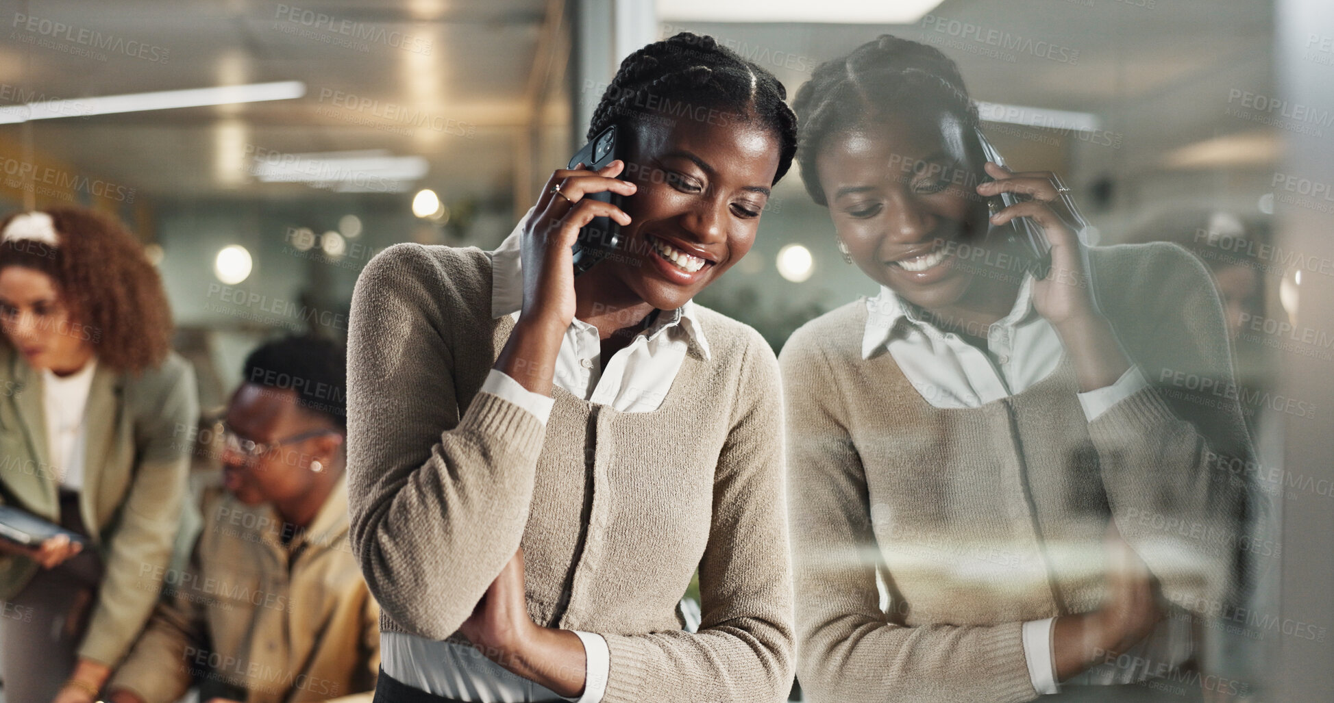 Buy stock photo Woman, phone call and happy by window, office and chat at night with reflection, contact or networking at company. African person, smile and smartphone for deal, overtime or talk at creative agency