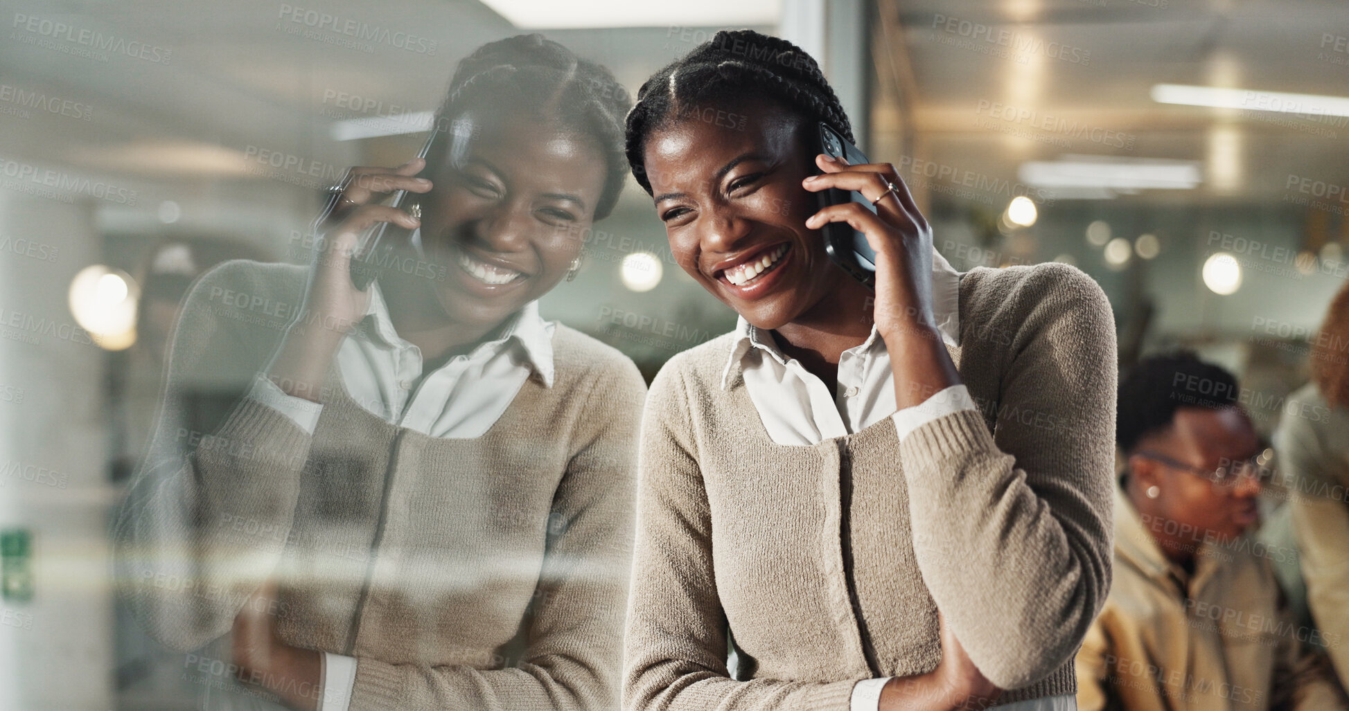 Buy stock photo Woman, phone call and smile by window, office and chat at night with reflection, contact or networking at company. African person, happy and smartphone for deal, overtime or talk at creative agency