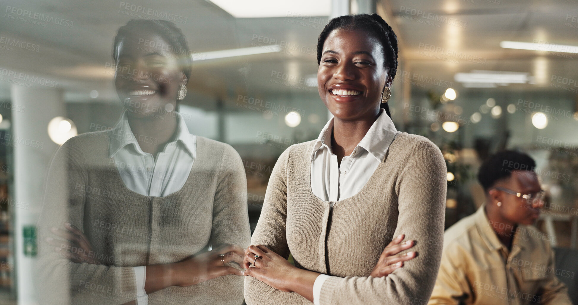 Buy stock photo Black woman, arms crossed and portrait at night in office for smile, pride and career at startup company. Person, writer or editor with job, excited or happy on overtime at creative agency in Nigeria