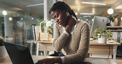 Buy stock photo Black woman, neck pain and injury with laptop at night for strain, pressure or overworked at office. Frustrated African, female person or employee with muscle tension or ache for fatigue or stress