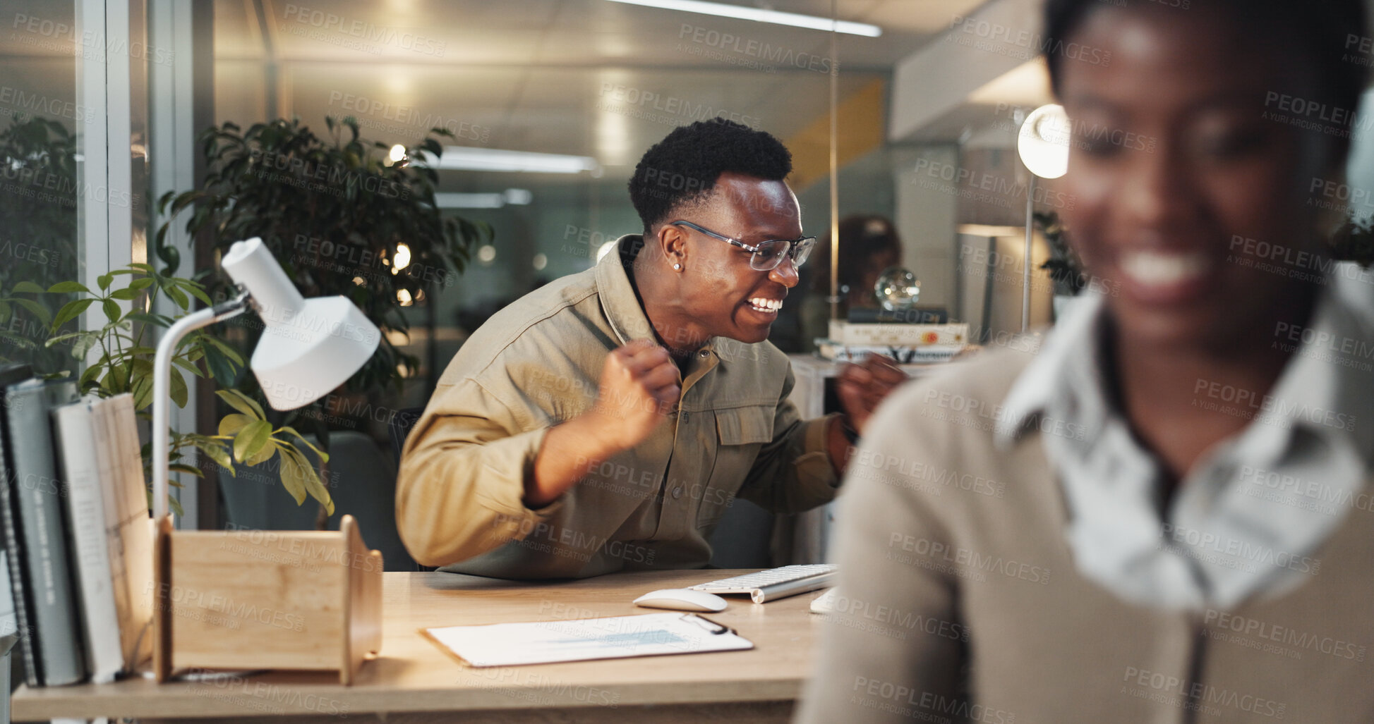 Buy stock photo Excited, black man or night with celebration for winning, promotion or offer at office desk. Happy African, male person or winner with smile on computer for victory, good news or success at workplace