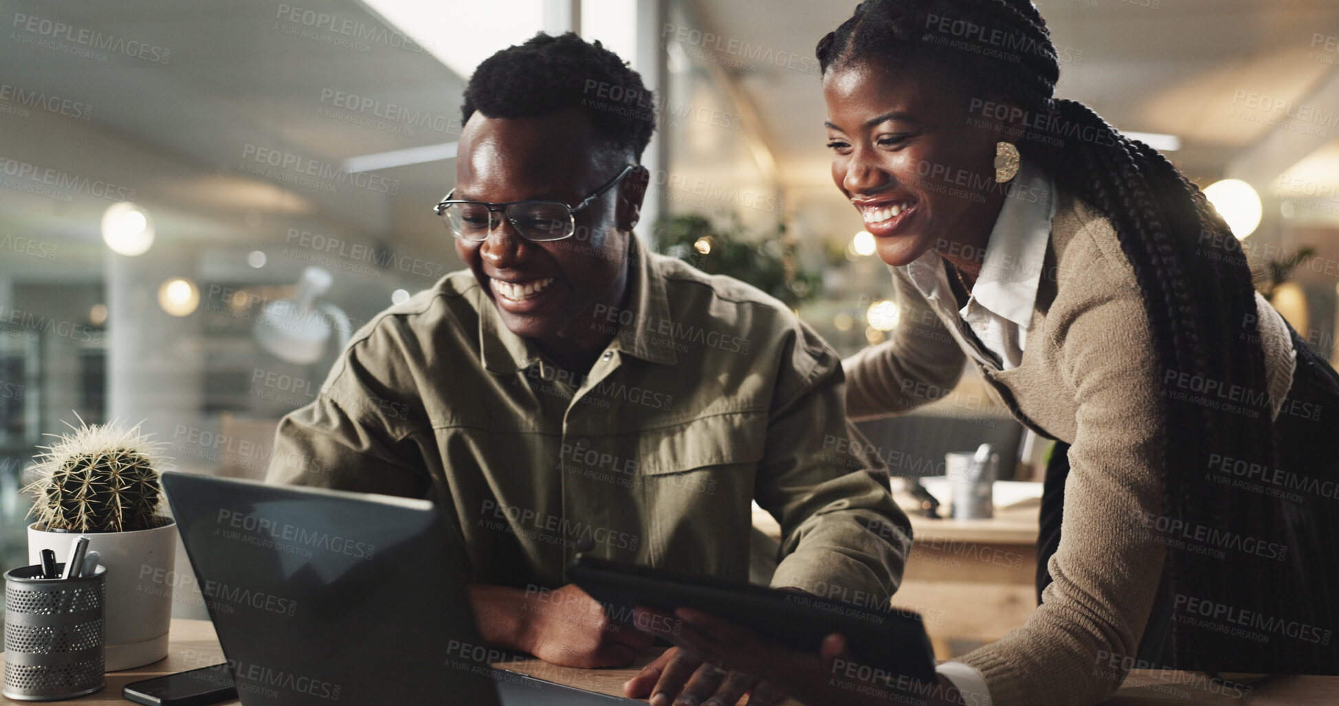 Buy stock photo Web designer, black people and laptop with laughing in working late as team or coworkers in office. Woman, man and tech for collaboration, project and together in digital agency for online navigation