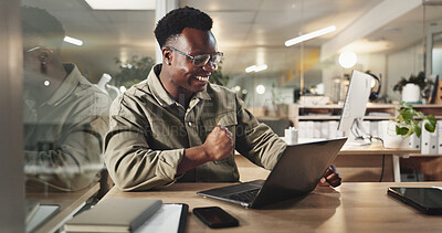 Buy stock photo Black man, laptop and celebration at night in office for goal, deal or deadline at media company. African person, writer and computer for feedback, cheers and success with project at creative agency