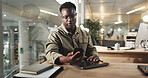 Black man, office and phone text at night with stress, deadline and burnout of employee. Reading, anxiety and professional contact with media project and brand deal planning with tech at work desk