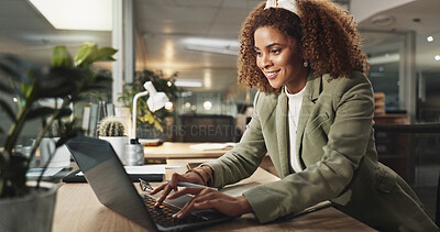 Buy stock photo Laptop, happy businesswoman and typing at night for report, magazine publication or deadline in startup office. Computer, writing and African worker with project, reading email or creative feedback