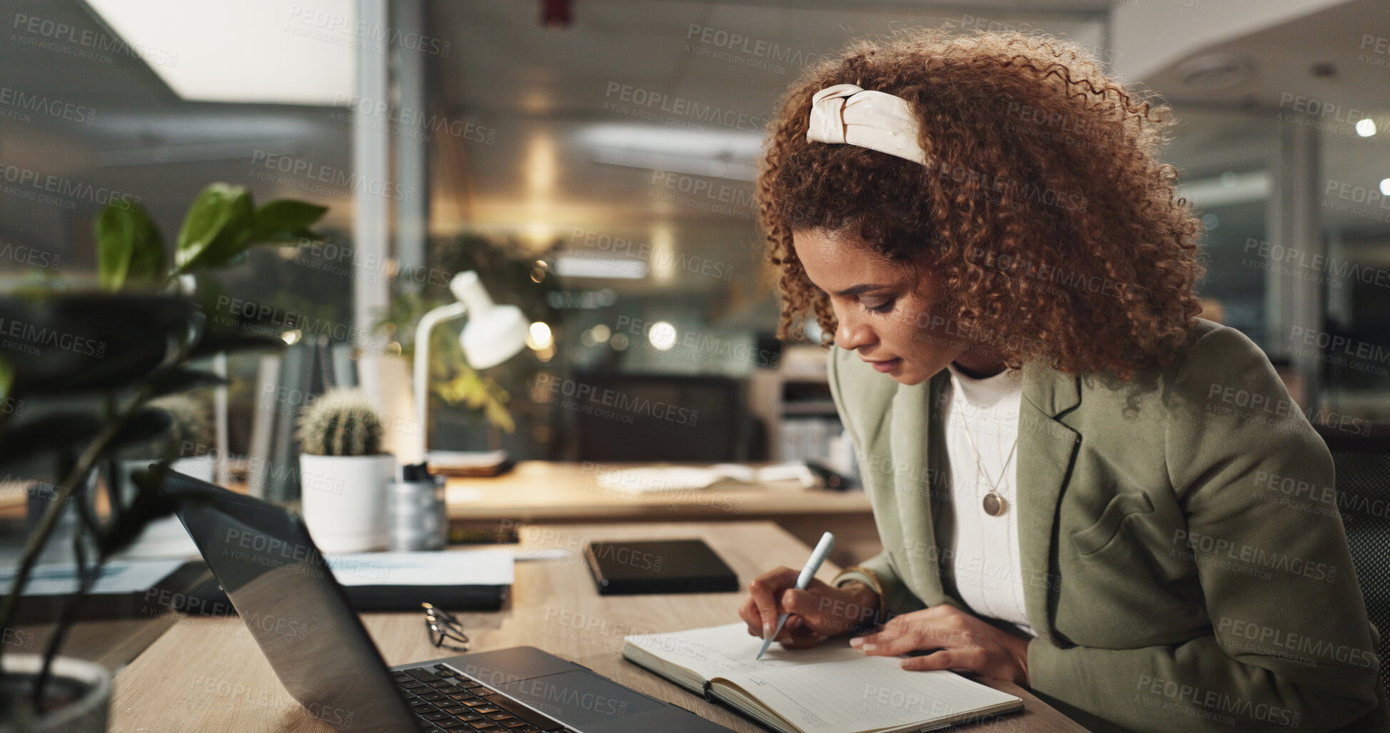 Buy stock photo Woman, writing and notebook at night in office for project, review or deadline for job at media company. Person, writer and reading with feedback, planning and process for article at creative agency