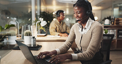 Buy stock photo Happy woman, call center and typing on laptop for telemarketing, business and laughing. Help, insurance and African agent on computer for customer service, funny joke and crm at night on deadline