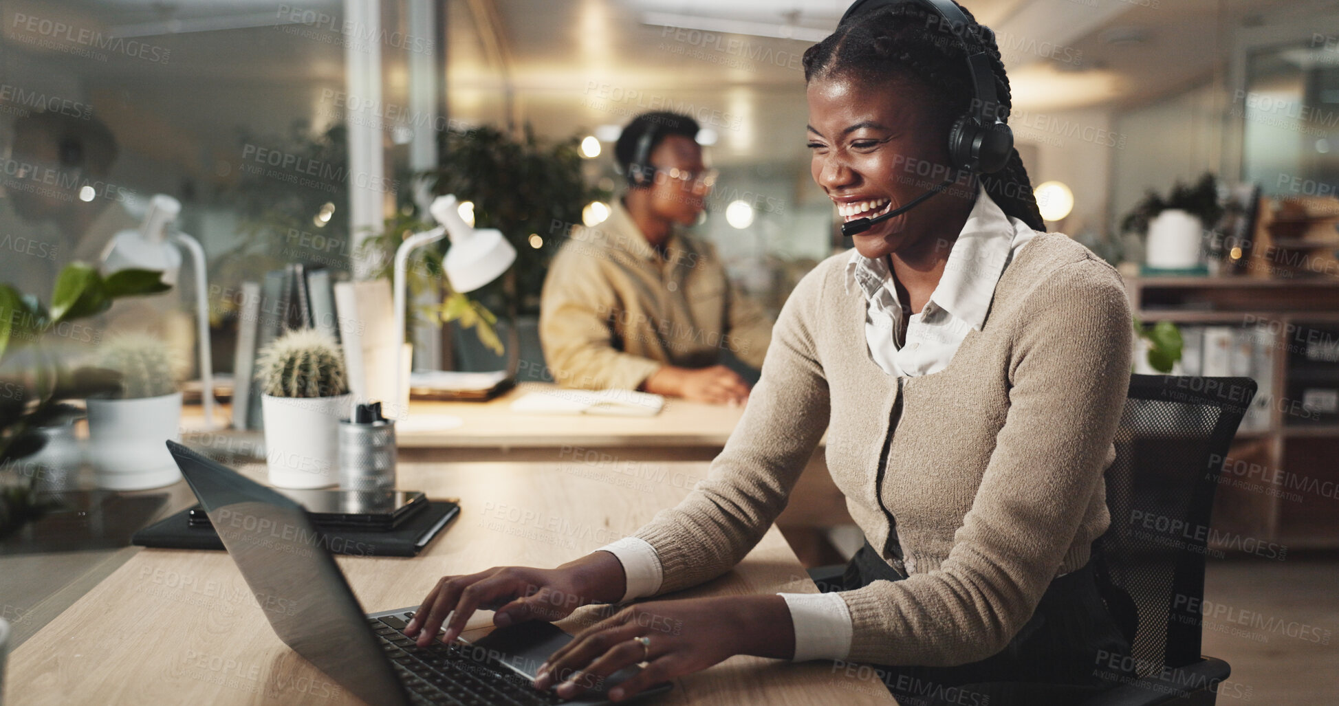 Buy stock photo Happy woman, call center and typing on laptop for telemarketing, business and laughing. Help, insurance and African agent on computer for customer service, funny joke and crm at night on deadline