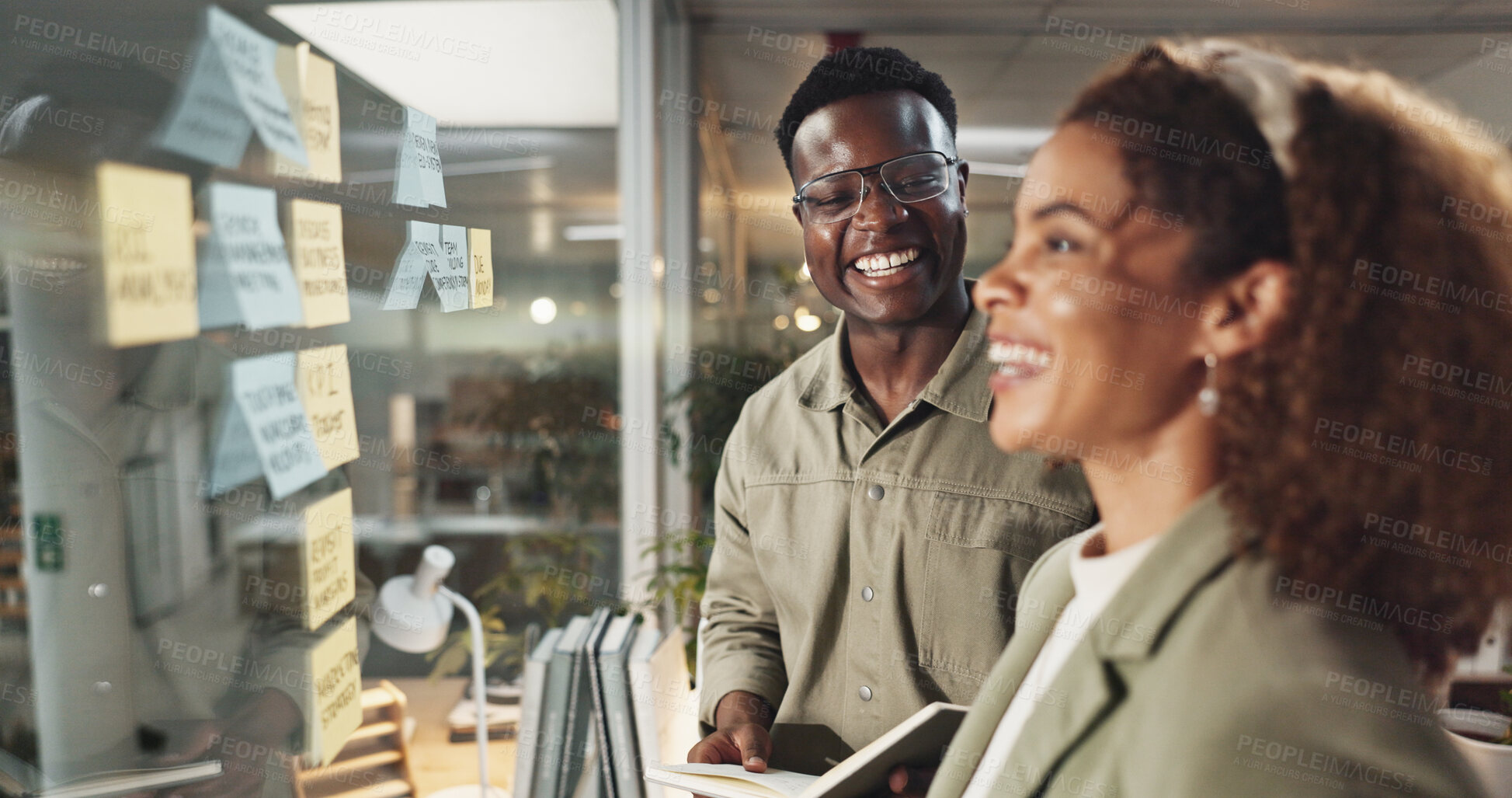 Buy stock photo Business, planning and people by glass wall with laughing for training joke and coaching workflow management. Night workshop, employees and sticky notes for upskill development and project strategy