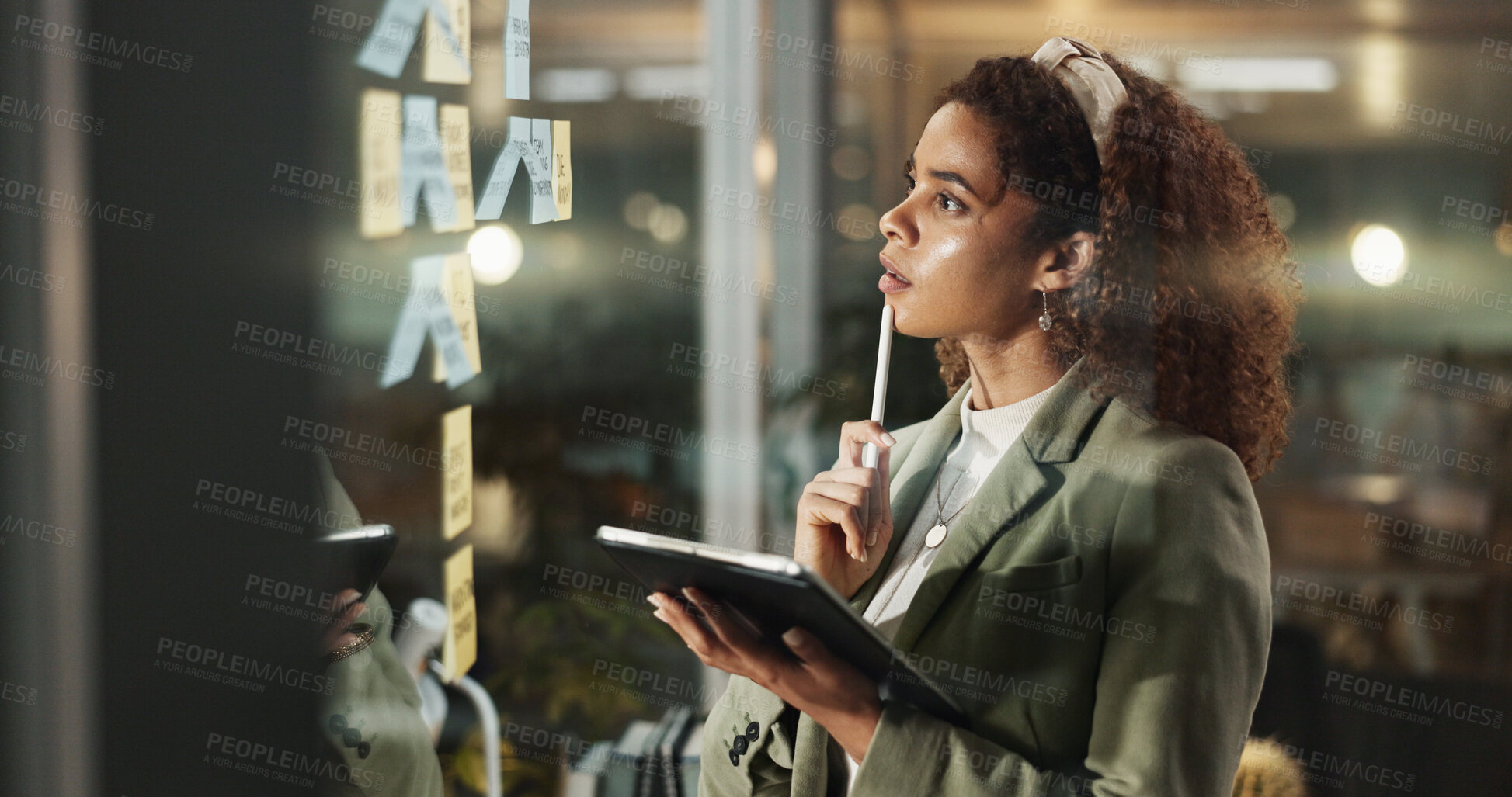 Buy stock photo Woman, tablet and thinking at glass for planning, priority deadline or sticky notes at night. Business person, tech or brainstorming in dark office for reminder, calendar schedule or ideas on window