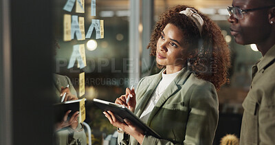 Buy stock photo Creative people, tablet and thinking at window for planning, collaboration or brainstorming with sticky notes. Workshop, design team or tech in agency for ideas, problem solving or moodboard on glass