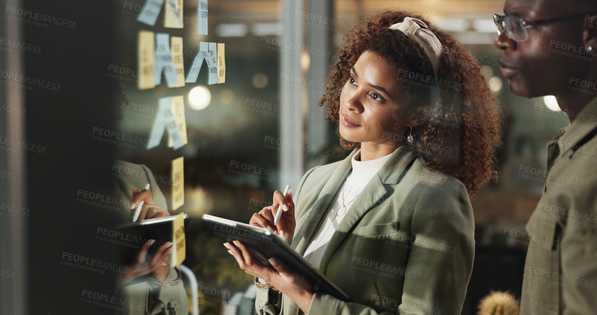 Buy stock photo Creative people, tablet and thinking at window for planning, collaboration or brainstorming with sticky notes. Workshop, design team or tech in agency for ideas, problem solving or moodboard on glass