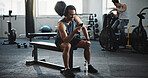 Fitness, gym and man with phone and headphones on break for social media, music and online podcast. Athlete, happy and person on smartphone for mobile app for exercise, training and workout progress