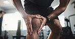 Man, hands and knee injury with pain at gym for muscle tension, workout accident or sprain. Closeup, male person or athlete with sore leg, pinch nerve or ache for joint inflammation at health club