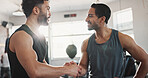 Fitness, men and handshake in gym for workout success, wellness challenge or training teamwork. Athlete, personal trainer or hand gesture at sports center for exercise progress or performance support