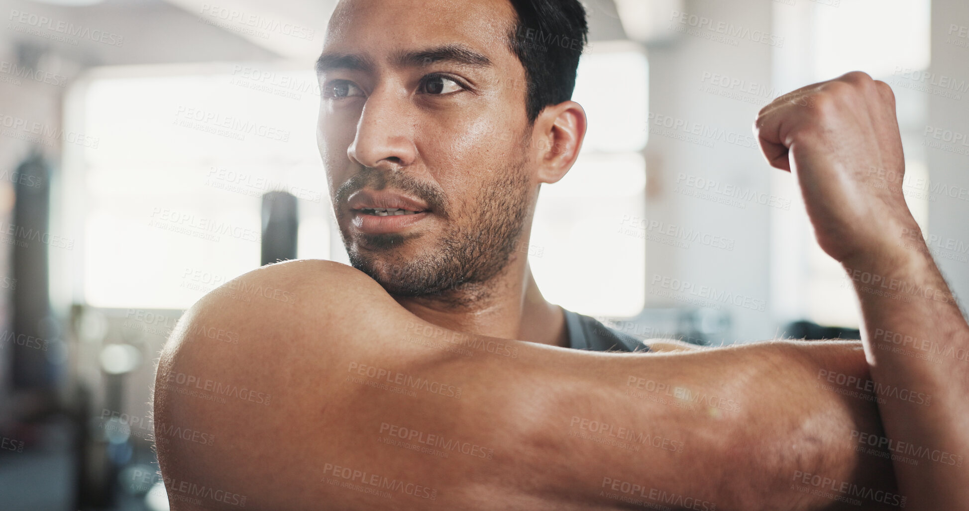 Buy stock photo Gym, asian man and arms with stretching for fitness, flexibility and wellness for muscle tension. Thinking, male person and bodybuilder with warm up for exercise, workout session and prepare in club