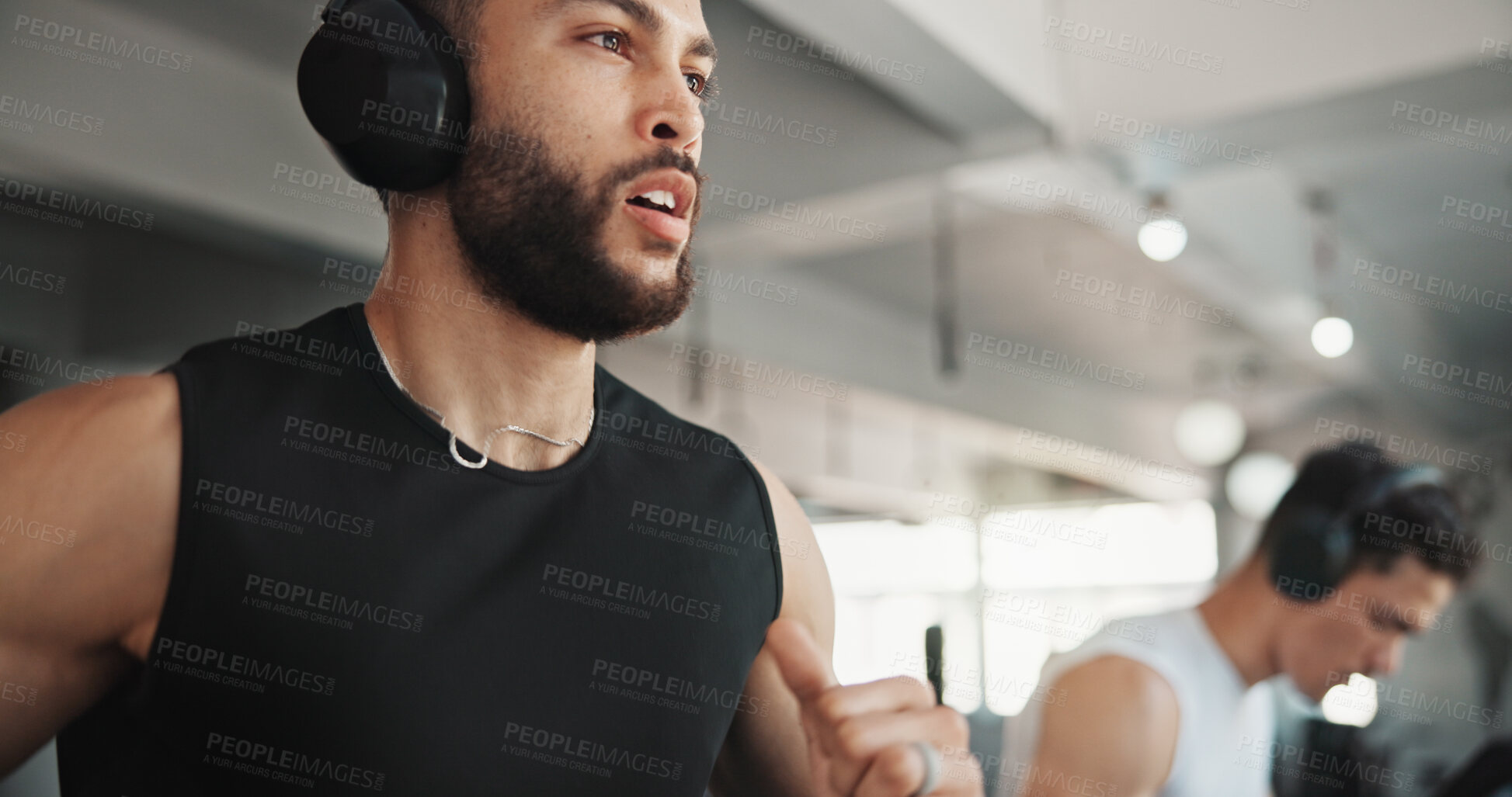 Buy stock photo Running, treadmill and music with man in gym for streaming, workout and cardio challenge. Health, fitness and podcast audio with person and headphones in sports center for exercise and wellness