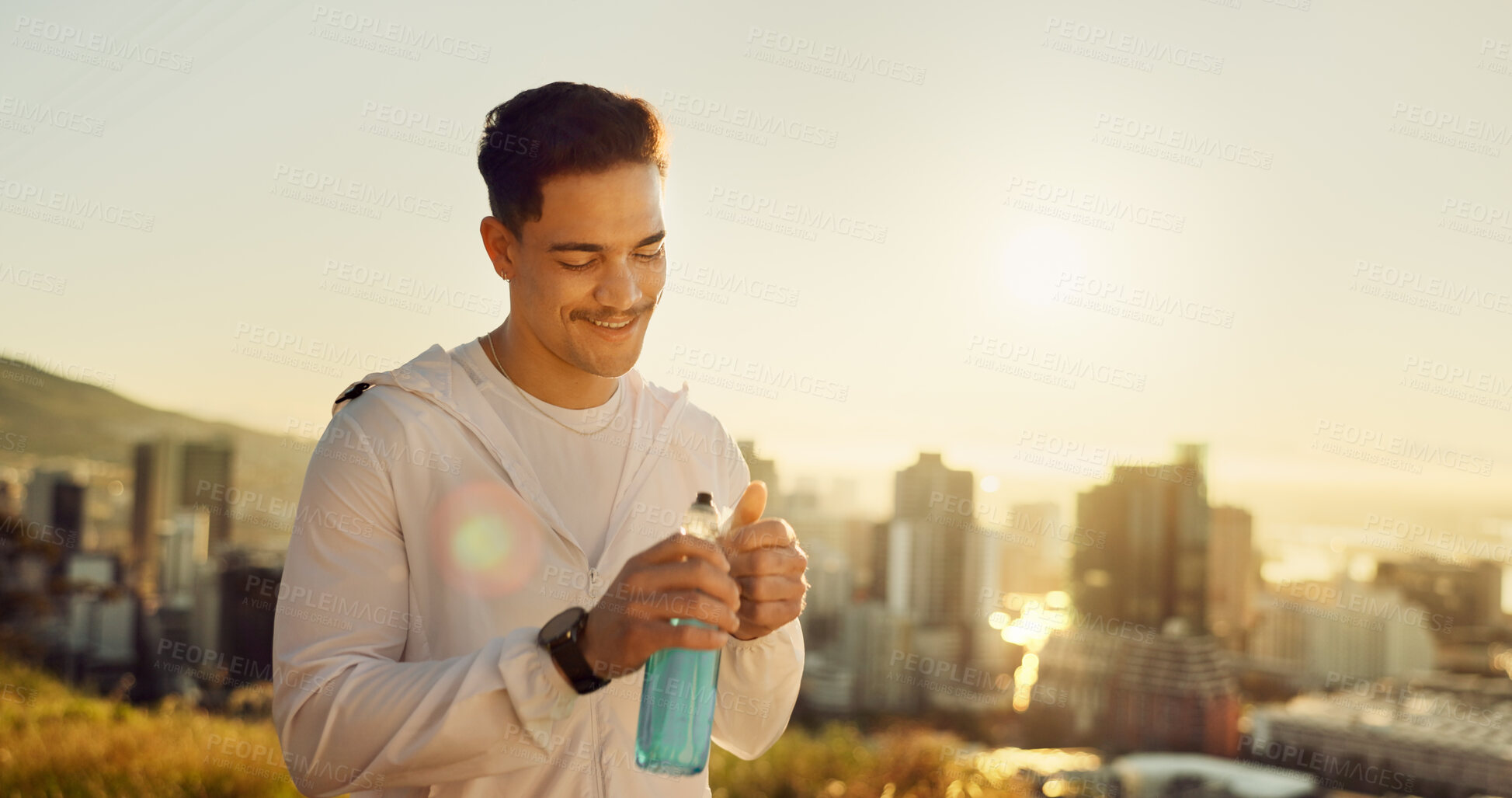 Buy stock photo Fitness, happy man and bottle in city for break, thirsty and endurance at sunset sky. Athlete, water or smile in Puerto Rico for healthy detox, electrolytes and rest with drink for energy or wellness