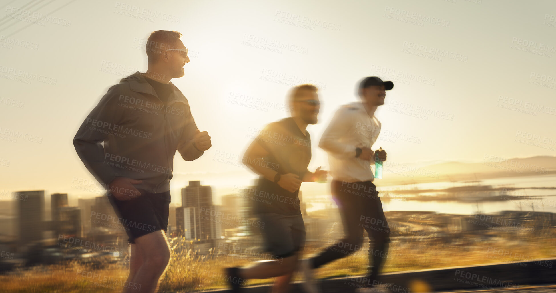 Buy stock photo Men, fitness and running with sunset or speed for exercise or outdoor training together on mountain. Active, male people or runners with motion blur for sprint, race or health and wellness in nature