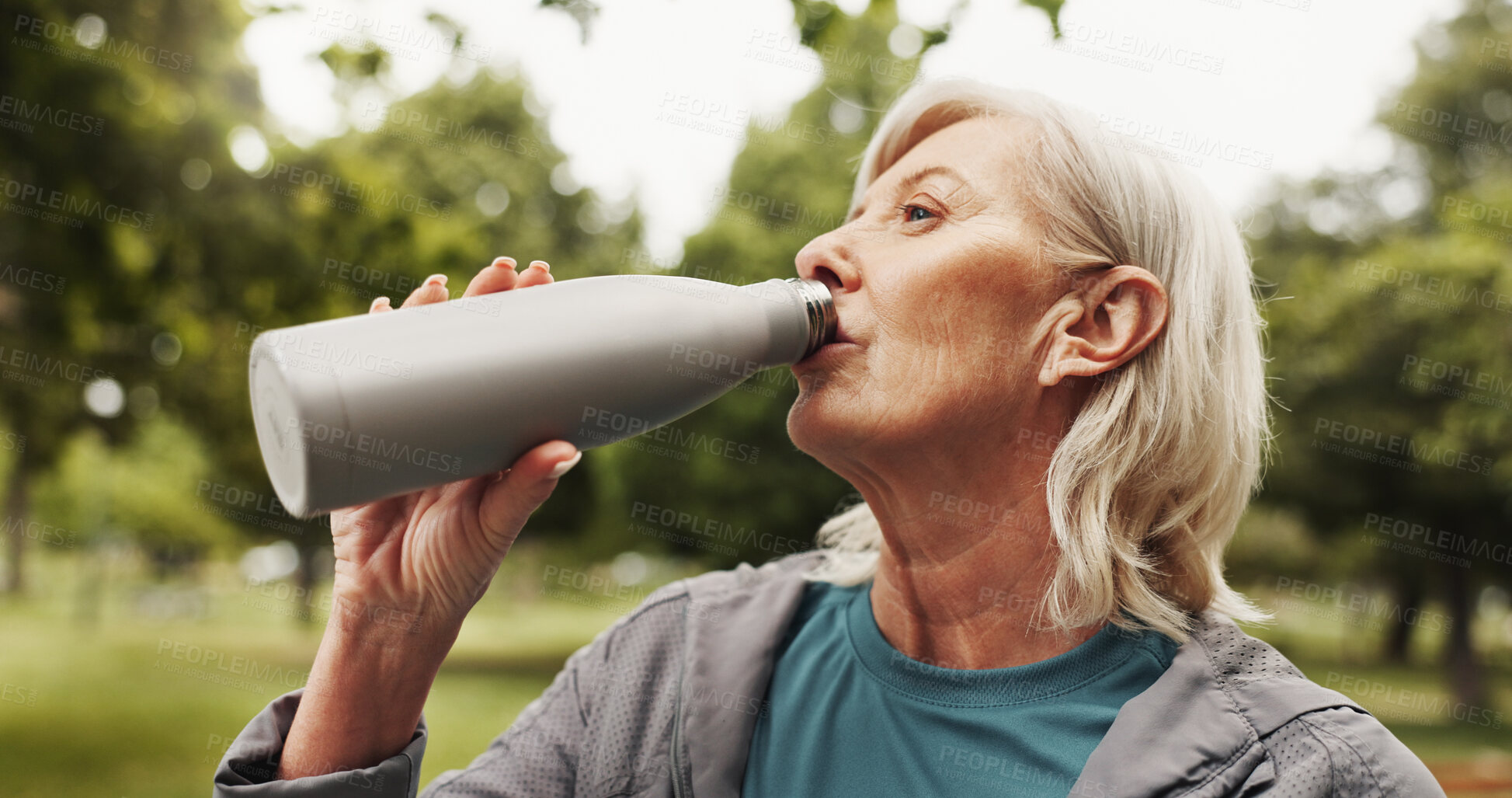 Buy stock photo Mature, woman and drinking water in park for fitness, health and wellness in nature. Hydration, thirsty and bottle for electrolytes with exercise, self care and senior female person outdoor for break
