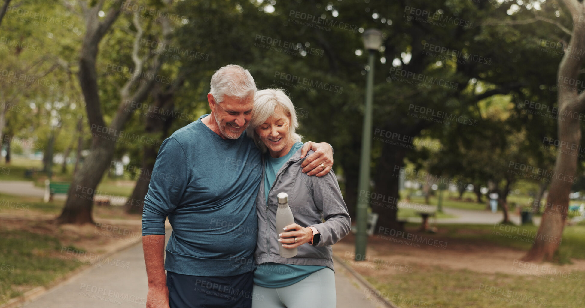 Buy stock photo Outdoor, park and mature couple with fitness, hug and marriage with exercise and water bottle. Nature, happy and people with love, smile and workout for health in the morning on weekend break