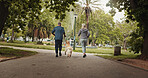 Dog walking, old couple and running in park together for outdoor fitness, health or wellness. Back, exercise or leisure with senior man and woman training pet Labrador in nature for animal obedience