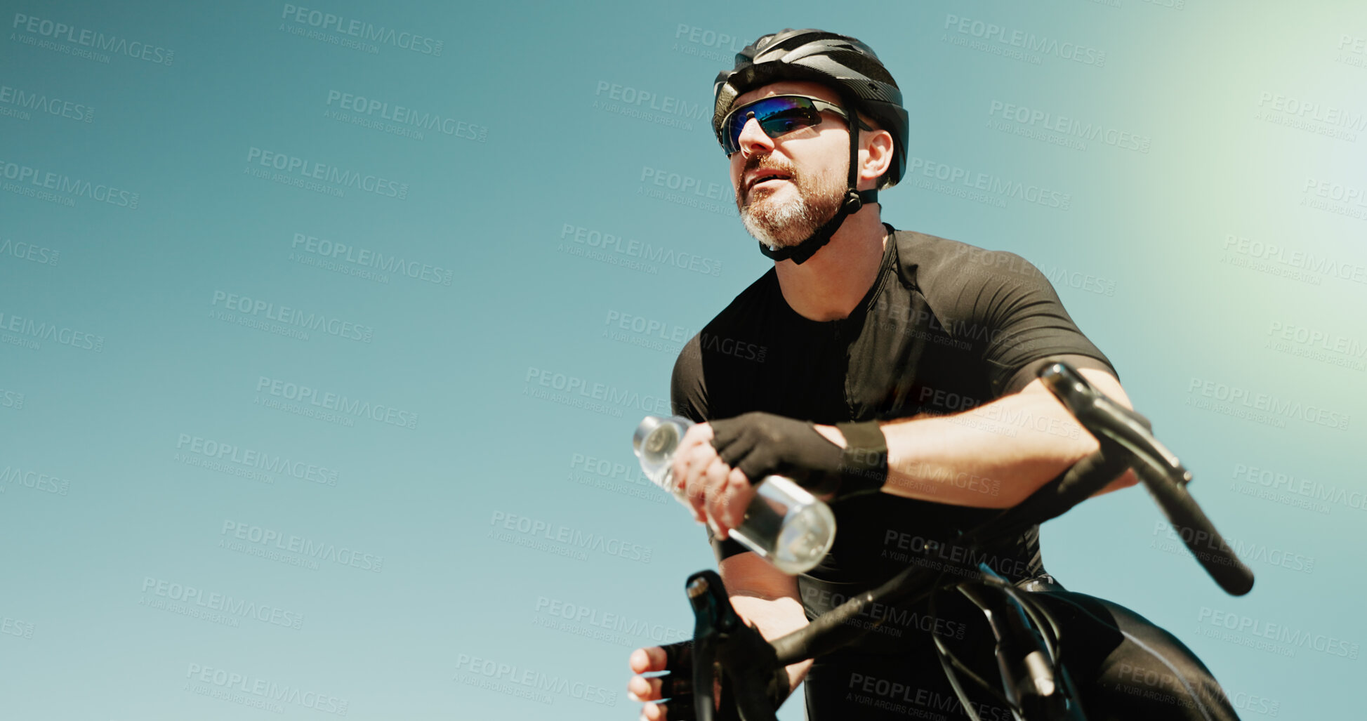 Buy stock photo Water, thinking and cycling with man in city for triathlon mockup space, electrolytes and workout. Wellness, exercise and vision with person and bike with low angle for sports, fitness and cardio
