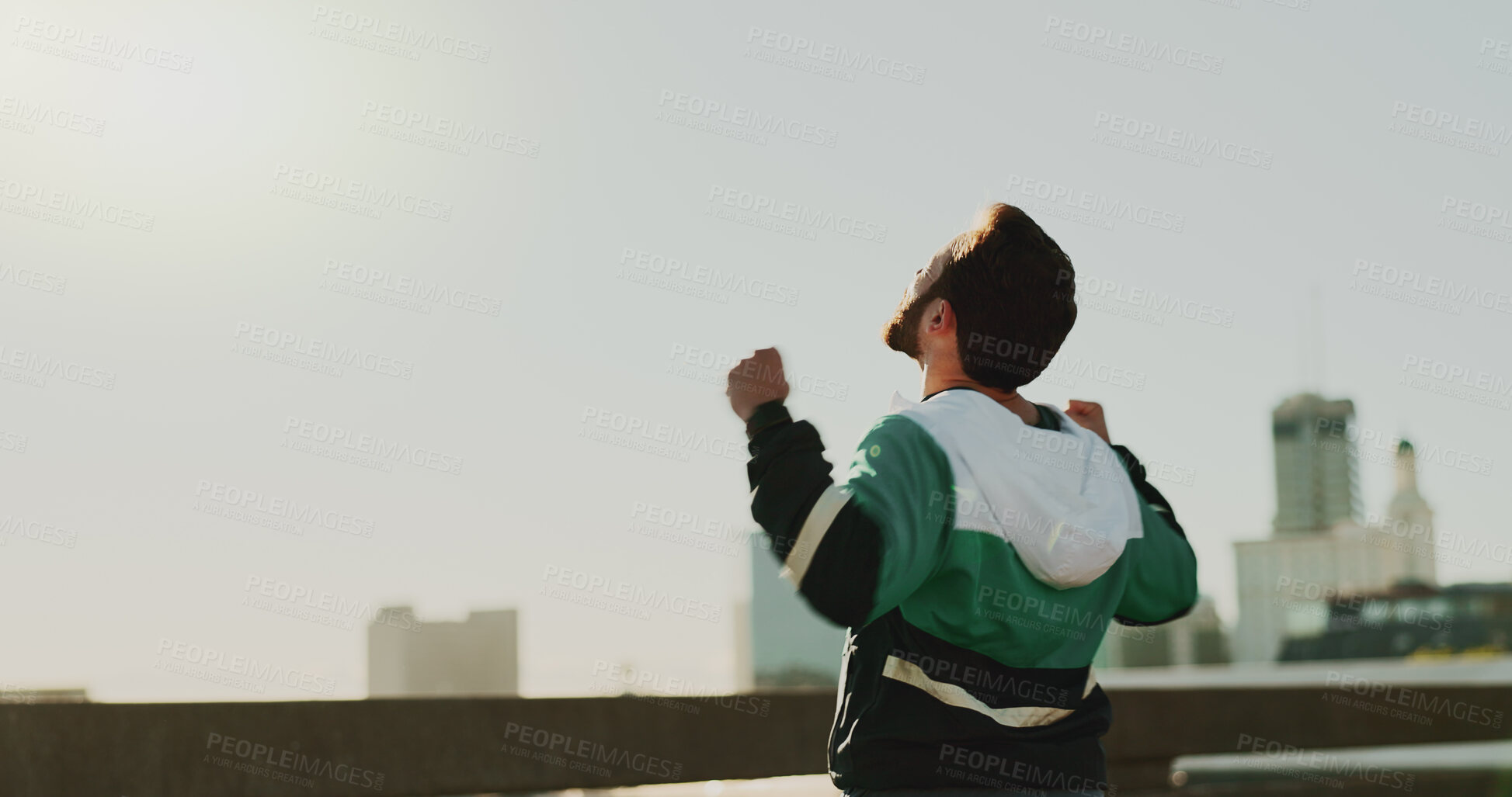 Buy stock photo Celebration, back and runner in morning, fitness and practice for marathon, success and mockup space. Sky, fist and accomplishment for routine, exercise and person in city, healthy and victory