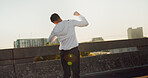 Back, athlete and man with celebration outdoor for workout success, exercise achievement and marathon goals. Fitness, person or victory fist on bridge for training milestone and pride for performance