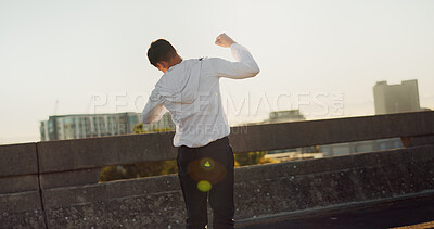 Buy stock photo Back, athlete and man with celebration outdoor for workout success, exercise achievement and marathon goals. Fitness, person or victory fist on bridge for training milestone and pride for performance