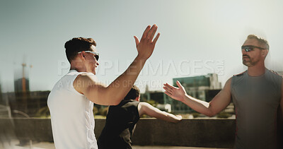 Buy stock photo Outdoor, men and celebration with high five for fitness, marathon challenge and support on bridge. City, personal trainer and client with hand gesture for exercise, solidarity and target for workout