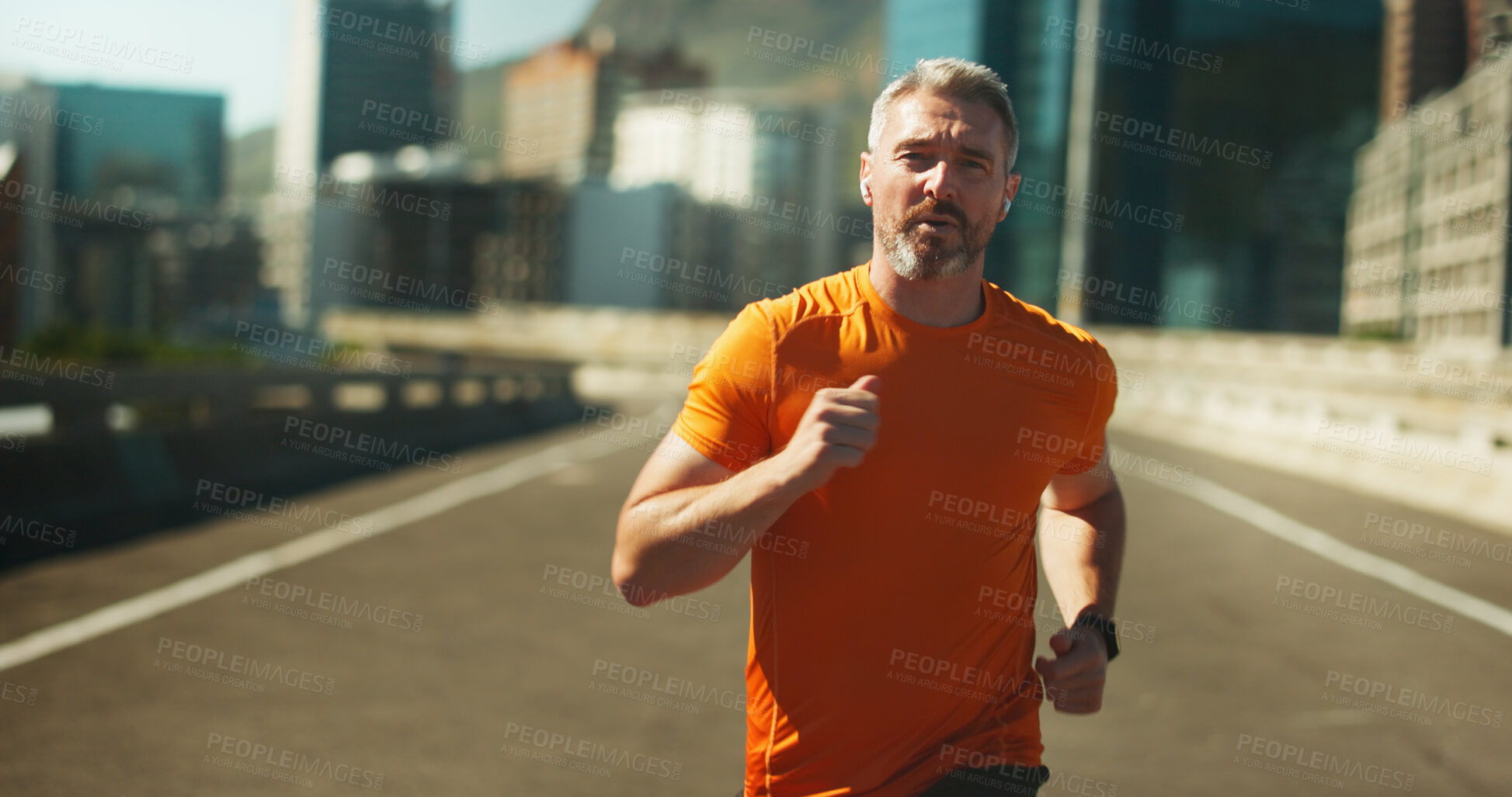 Buy stock photo Man portrait, city and running with earphones for fitness, streaming music and road for cardio. Mature person, urban street and athlete for sports workout, hearing song and town for exercise activity