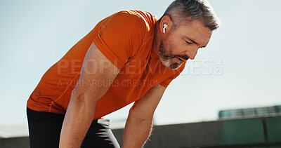 Buy stock photo Fitness, tired and man in city, sports and exhausted with challenge, workout and break. Mature person, outdoor and runner with exercise, training or health with fatigue, relax or athlete with routine