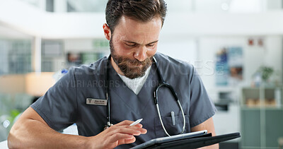 Buy stock photo Tablet, man and surgeon in hospital with medical research, telehealth or feedback on website. Digital technology, reading and male healthcare worker with online surgery or treatment plan in clinic.