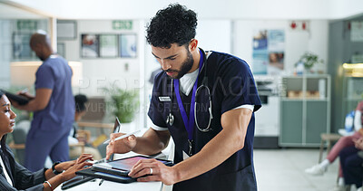 Buy stock photo Tablet, man and doctor in hospital with notes for medical research, telehealth or feedback. Digital technology, reading and male healthcare worker with online surgery or treatment plan in clinic.