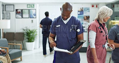 Buy stock photo File, man and doctor in hospital with healthcare report, research or feedback on postop. Medical folder, reading and male surgeon with surgery or treatment plan approval document in clinic lobby.