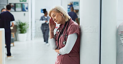 Buy stock photo Surgeon, headache and woman with stress, tired and fatigue with mental health challenge in hospital. Nurse, migraine and mature medical professional with depression, burnout and sick or exhausted