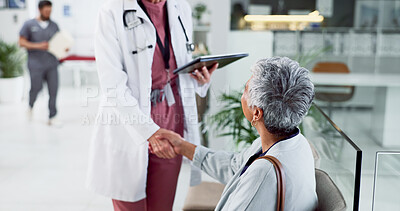 Buy stock photo Doctor, handshake and tablet with old woman in hospital for consulting, meeting and healthcare results. Support, advice and digital report with people for medical exam, life insurance and patient