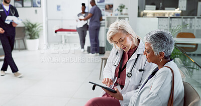 Buy stock photo Doctor, talking and tablet with old woman in hospital for consulting, meeting and healthcare results. Support, advice and digital report with people for medical exam, life insurance and patient