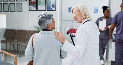 Buy stock photo Doctor, back and consulting with old woman in hospital for meeting, diagnosis and healthcare results. Support, advice and report with people in clinic for medical exam, life insurance and patient