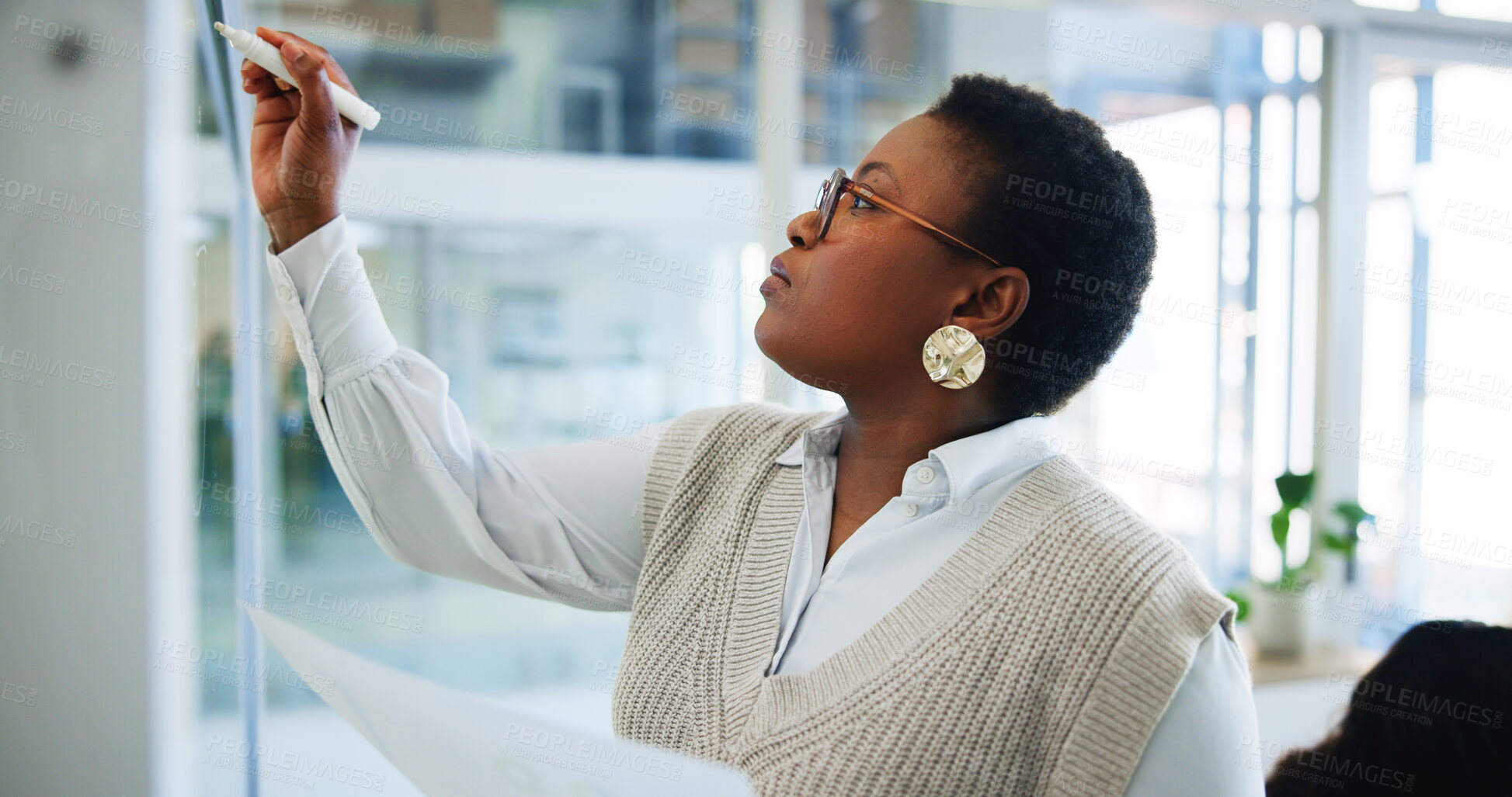 Buy stock photo Black woman, writing and schedule planning with glass board for project management or tasks at office. African, female person or employee taking notes for agenda, brainstorming or ideas at workplace