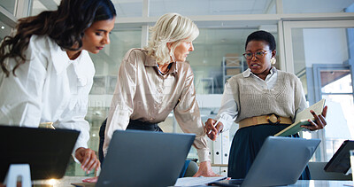 Buy stock photo Business women, meeting or collaboration with laptop for project planning or discussion at office. Female people, employees or colleagues working on computer for sharing ideas or insight at workplace