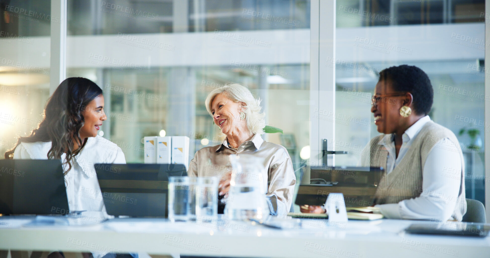 Buy stock photo Happy, business women and meeting with team for discussion, conversation or collaboration at office desk. Female people, employees or colleagues with smile for productivity, project or development