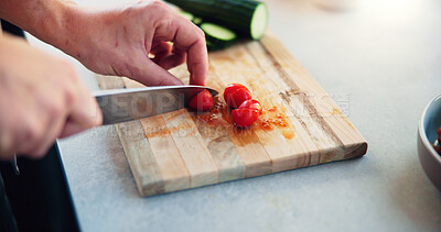 Buy stock photo Hands, knife and tomato on chopping board in home for salad, cooking and meal prep for wellness in morning. Person, fruit and cucumber for nutrition, benefits and food for gut health at apartment