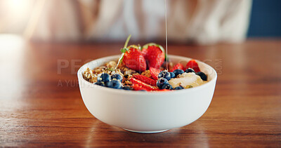 Buy stock photo Granola, diet and fruit muesli on kitchen counter for weight loss, wellness and nutrition for breakfast. Closeup, bowl and health food with protein, honey and detox in cereal and porridge in home